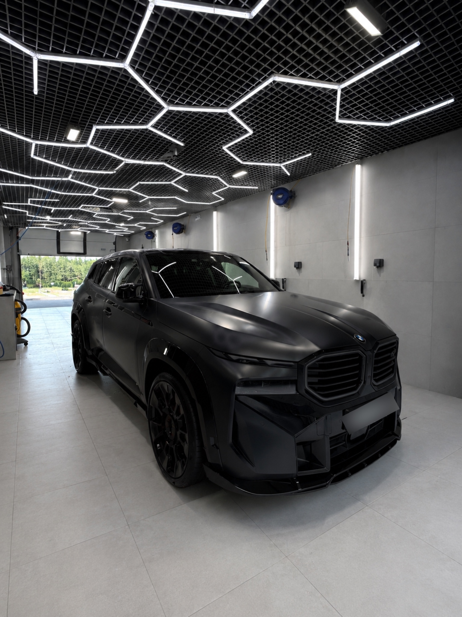 BMW с матовой чёрной пленкой в студии детейлинга OHTAAWA